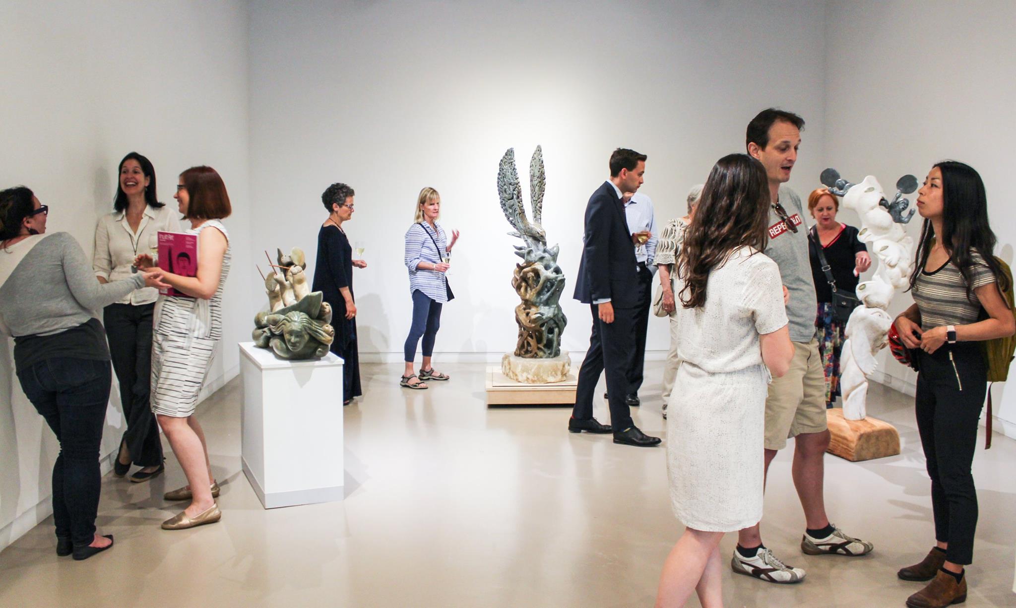 Guests attend the opening of Abraham Anghik Ruben's exhibition at Feheley Fine Arts in Toronto